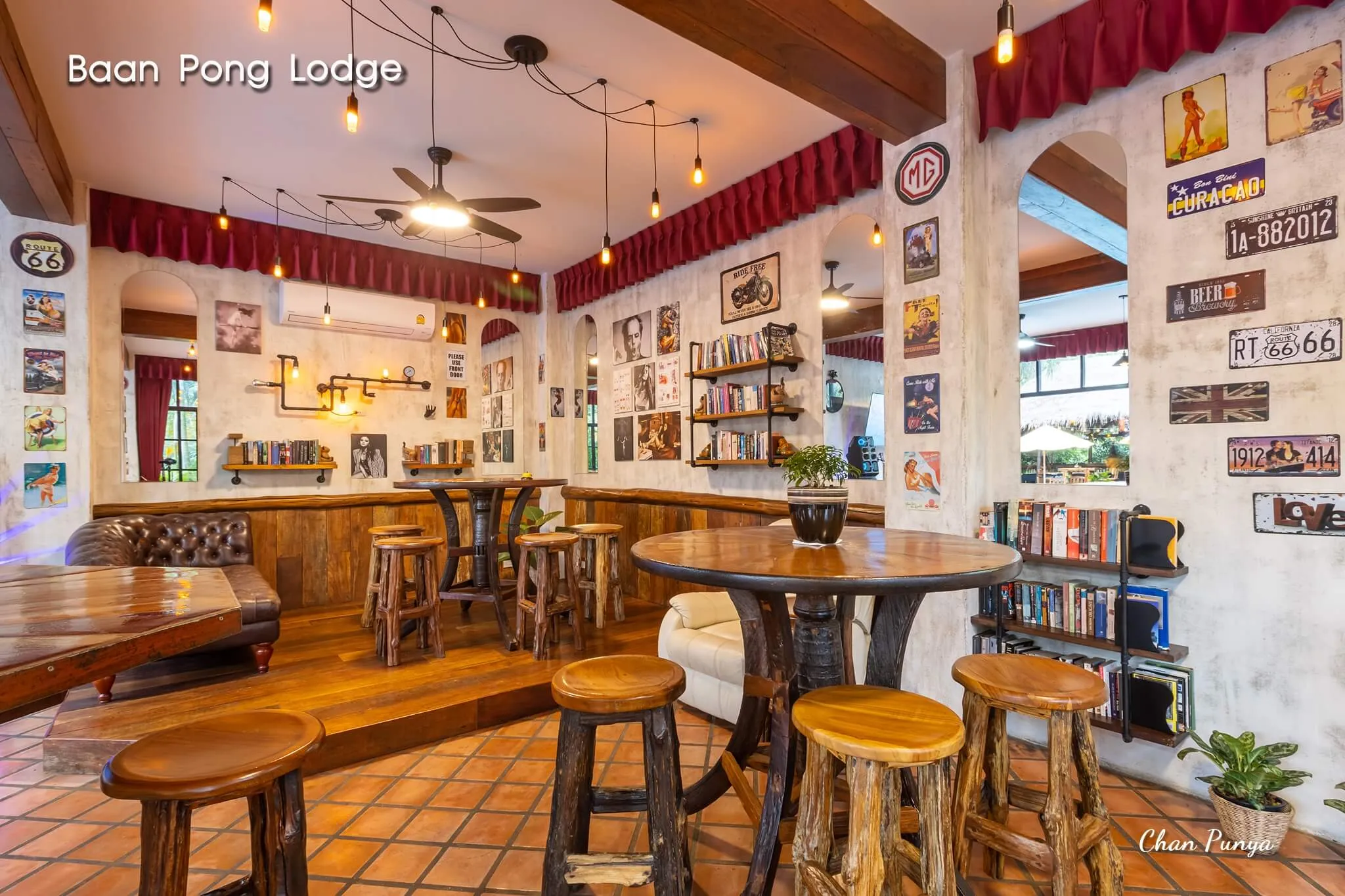The bar room, lined with books and framed photographs
