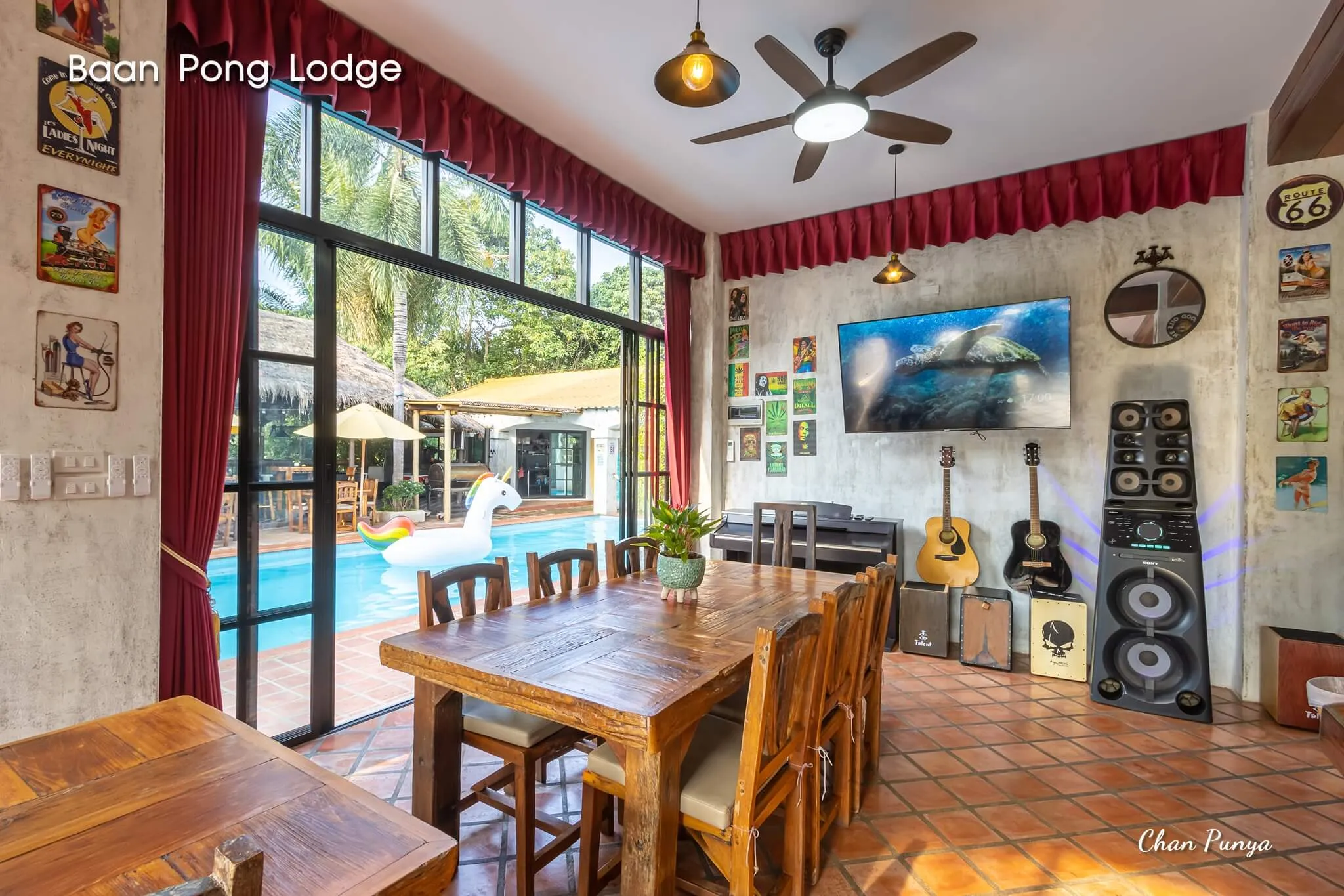 The dining room, its long table looking out to the pool