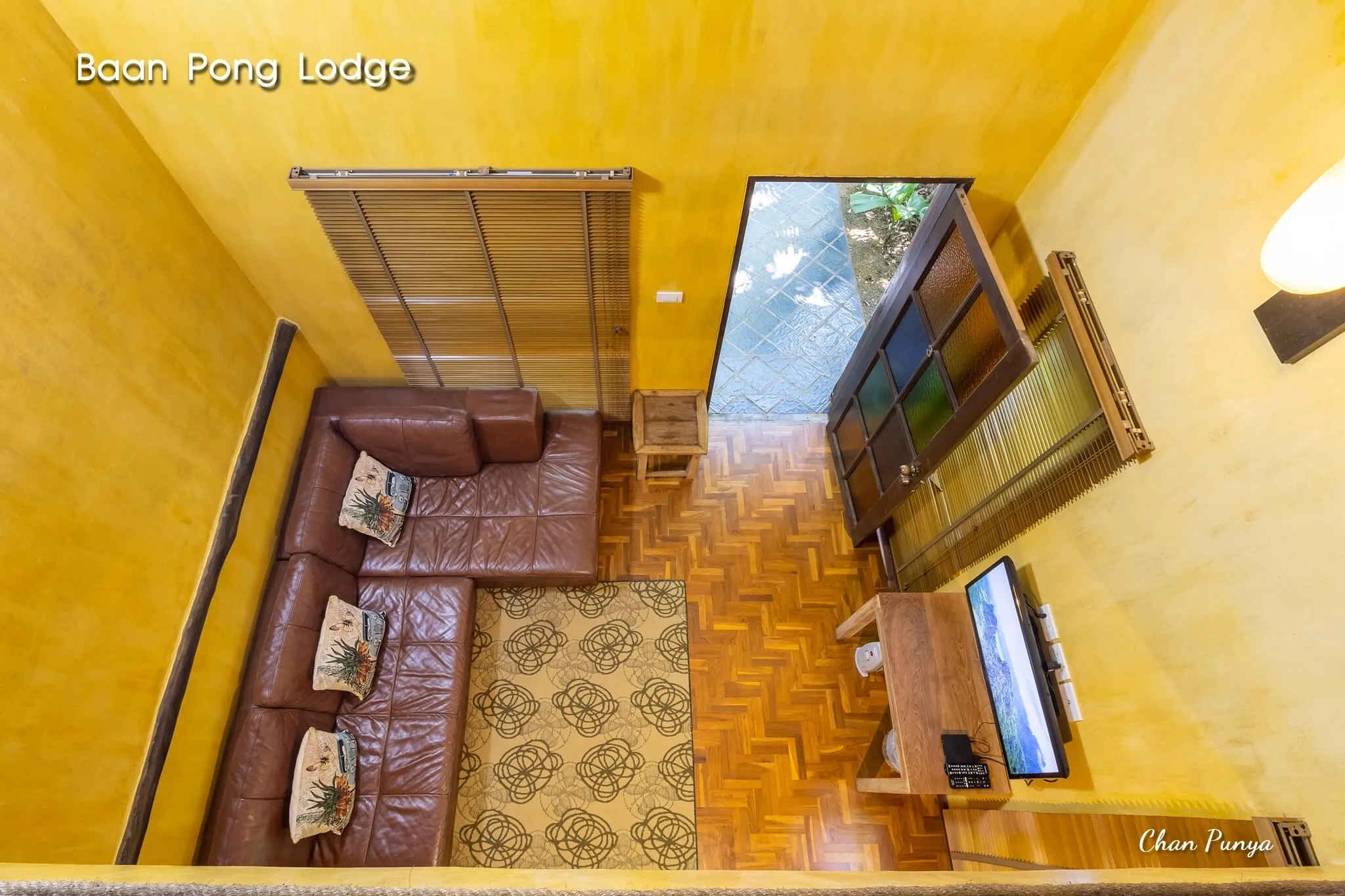 A living room from above, sofa and television on parquet