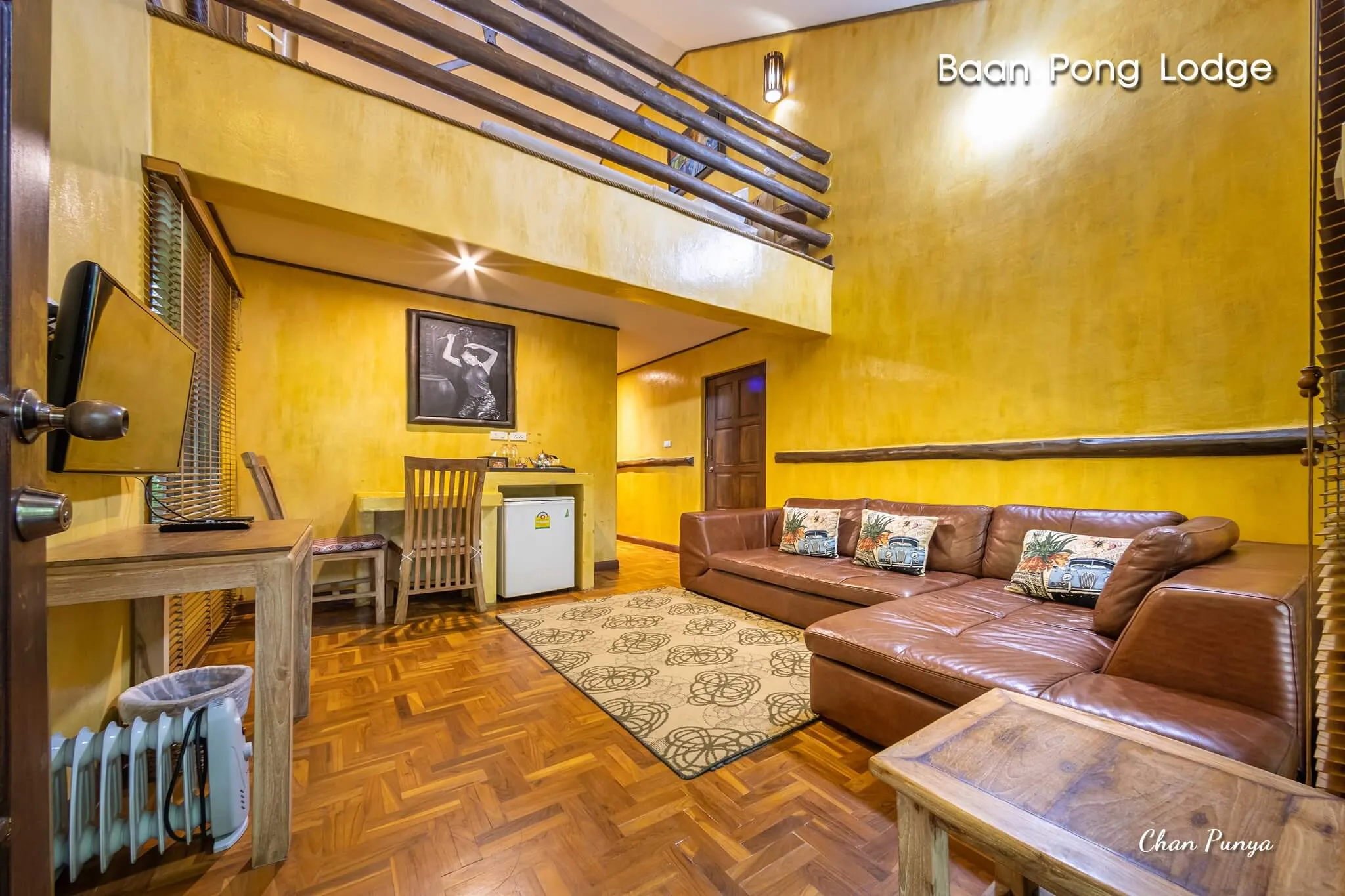 A loft chalet from the door, with the lounge below and the sleeping level above