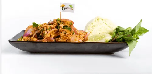 Laab Isaan, minced pork with herbs, served with cabbage and long beans