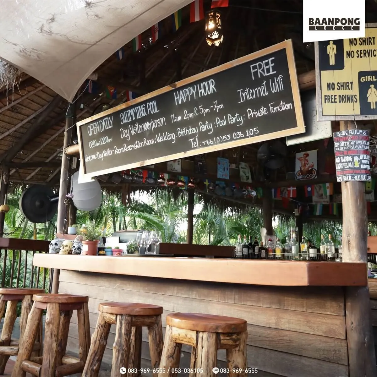 The thatched poolside bar, with bottles along the counter