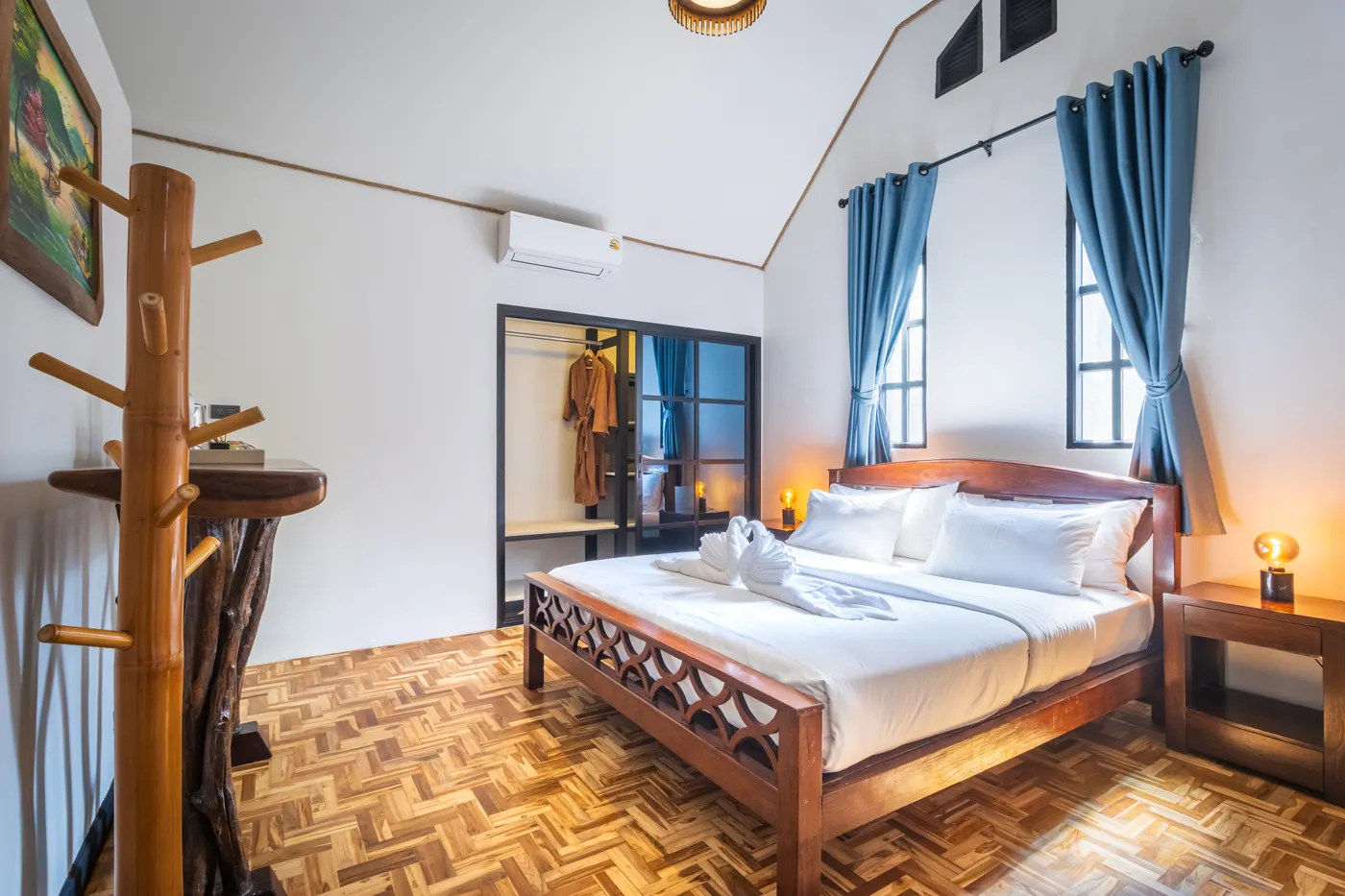The bedroom of a family junior suite, with the wardrobe and the coat stand