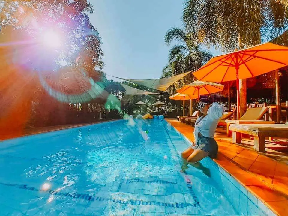 Jumping into the pool in the sunshine
