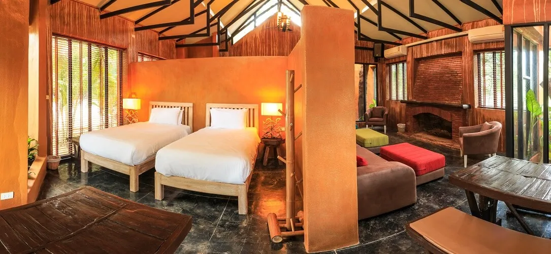 A family room, twin beds behind a partition