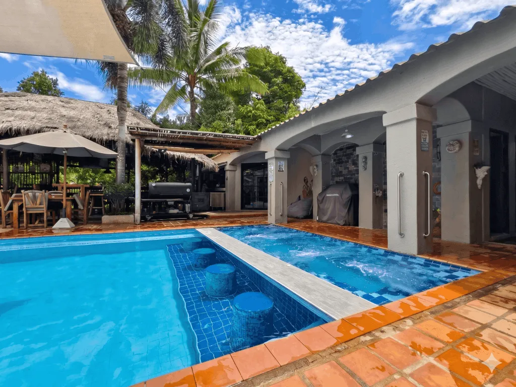 The pool with the thatched bar at the far end
