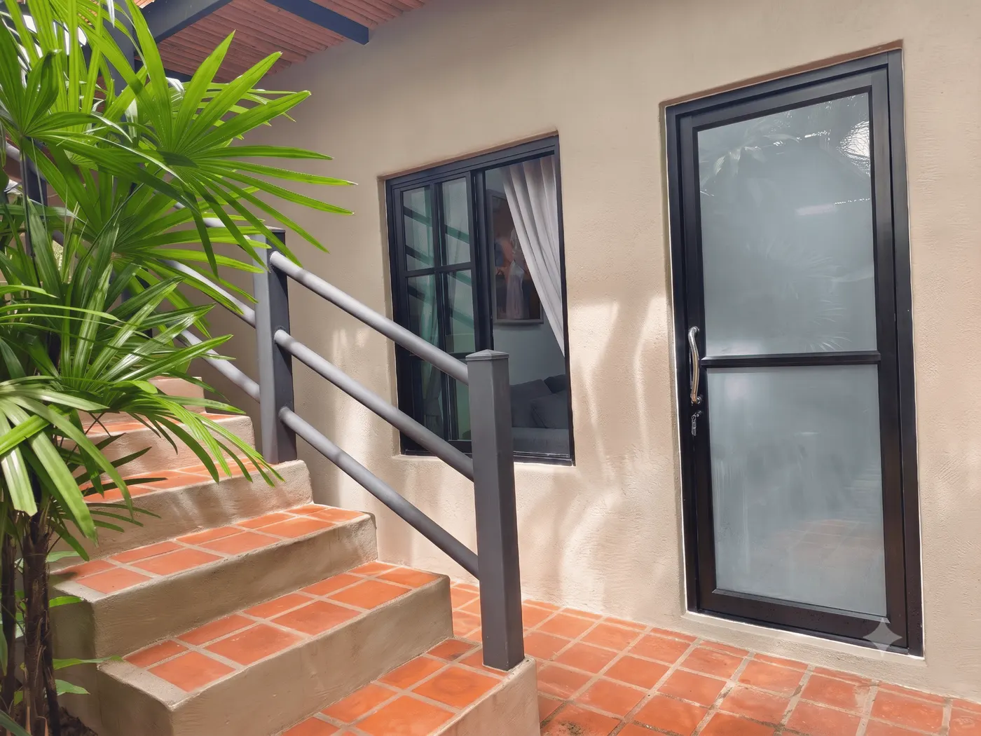 The brick steps up to the door of a single-floor deluxe room